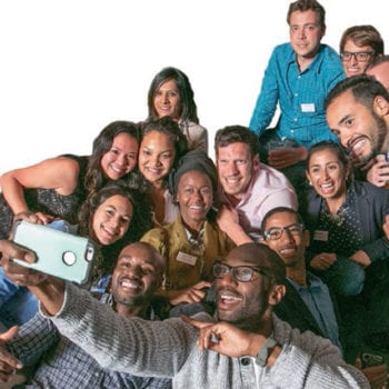 Incoming full-time MBA students pose for a selfies during orientation week