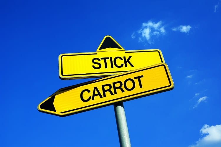 Stick vs Carrot - Traffic sign with two options - education based on enticement and rewards vs raising based on punishment and threat