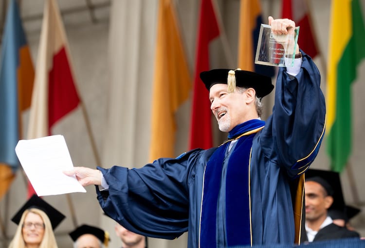 Dean Lyons receives Culture of Haas award at undergraduate commencement.