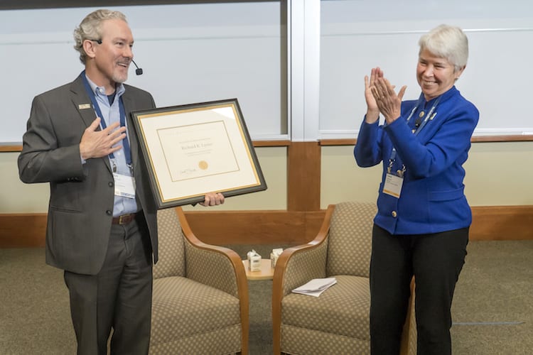 Dean Rich Lyons accepts the Berkeley Citation award from Chancellor Carol Christ.