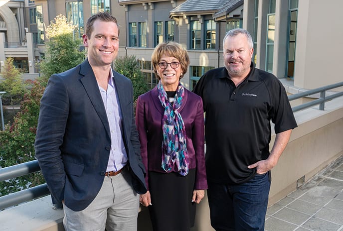 Leaders of the Greater Sacramento Chapter of the Year Brent Haapanen, MBA 13, and Mark Beckford, MBA 96, posewith Interim Dean Laura Tyson