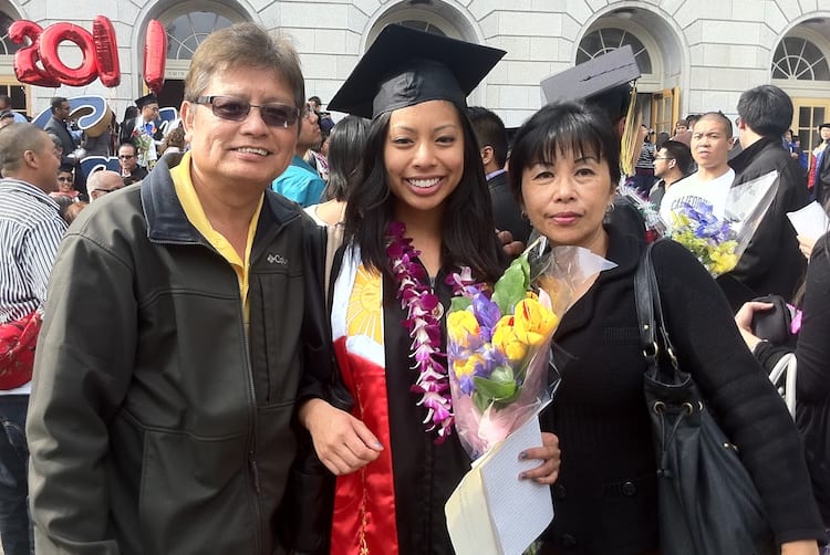 Catherine with her parents at her UC Berkeley undergraduate commencement.