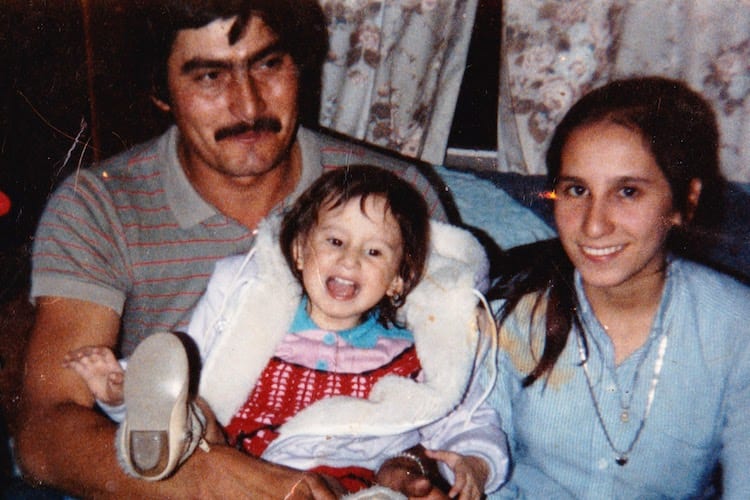 Brenda at age two with her parents.