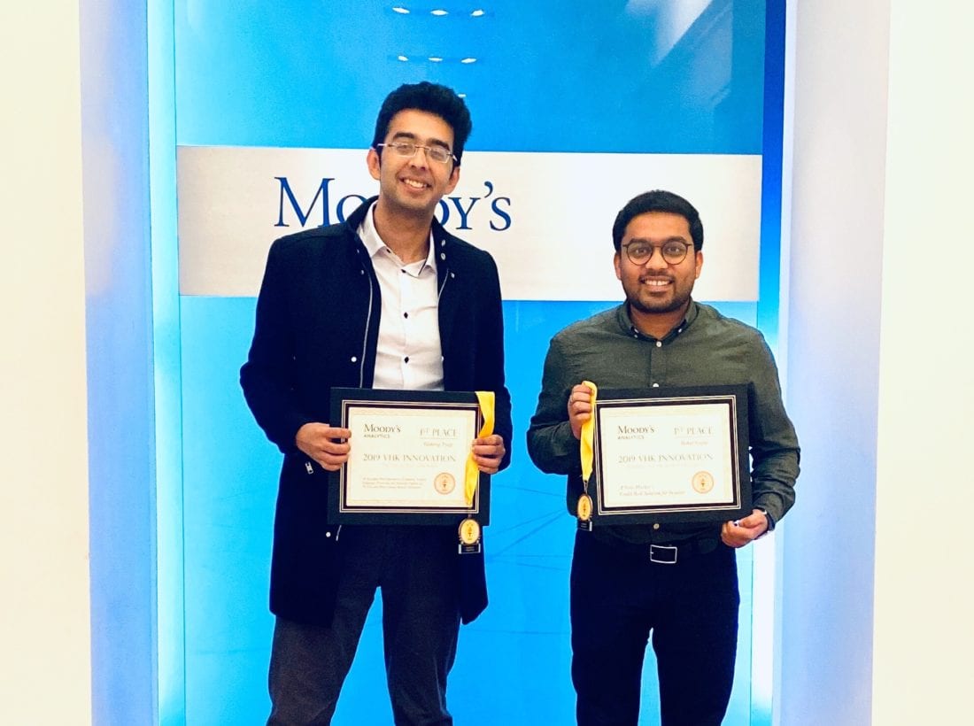 Two Berkeley MFE students holding awards