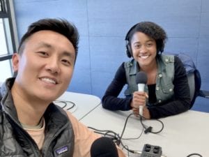 Two students participate in a podcast.