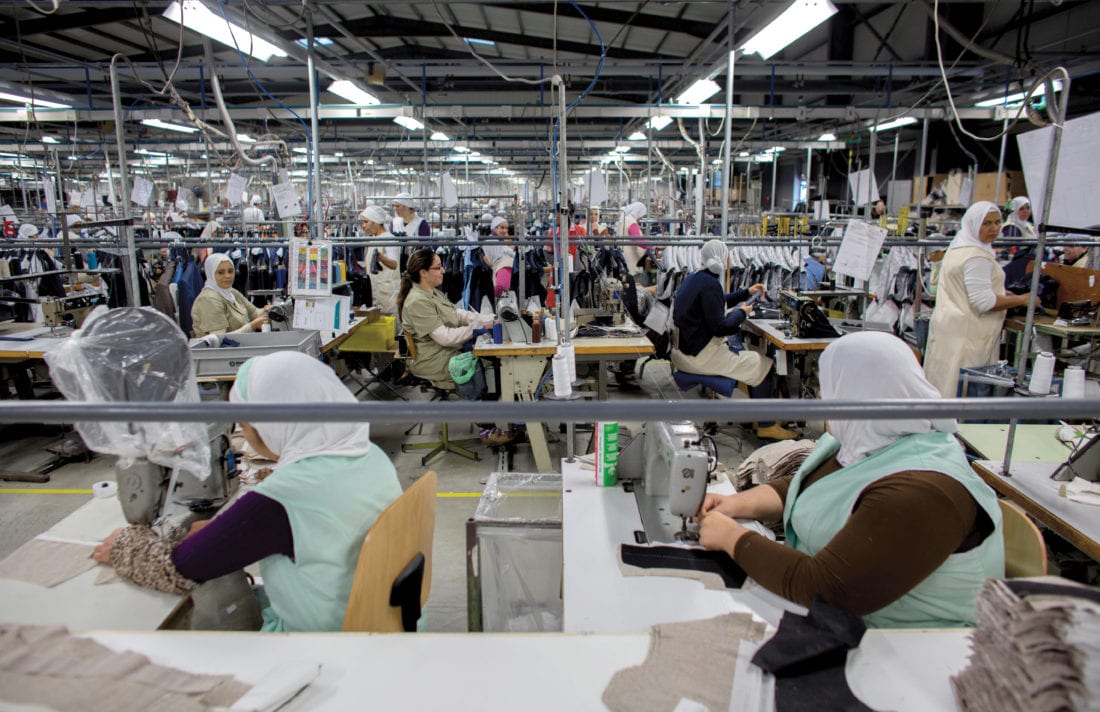 Factory workers sewing clothes