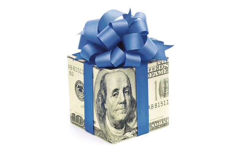 Hundred dollar bill shaped like a gift with a blue bow on top.