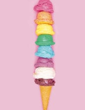 ice cream cone with 8 scoops of multicolored ice cream.