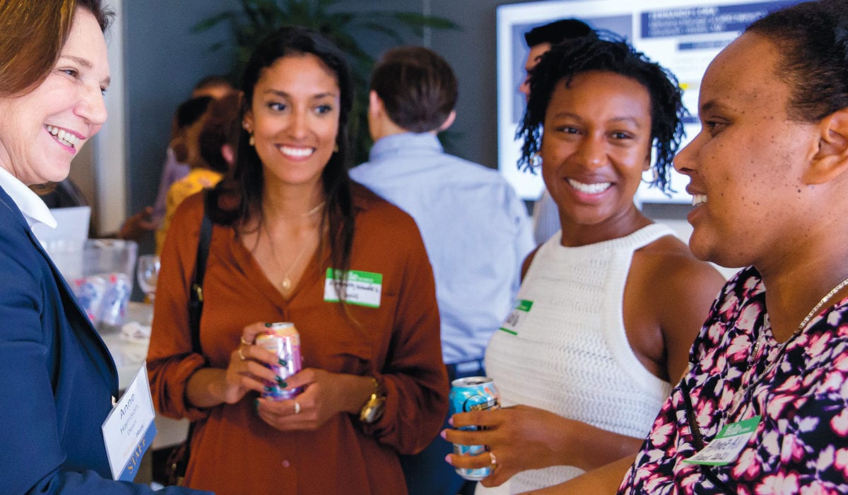 Dean Ann Harrison with Kimberly Mendez, Nicole Austin-Thomas, and Almaz Ali, MBA 21s, at the Berkeley Haas Consortium student welcome event in 2019. 