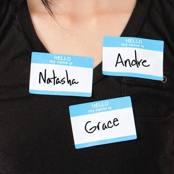 Person wearing three nametags: Natasha, Andre, and Grace.