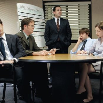 Scene from the TV show The Office showing manager Michael Scott and disinterested employees.