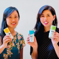 Olivia Chen, BS 98, and 2001 Cal alumna Pauline Ang holding their new product, Twrl Milk Tea.