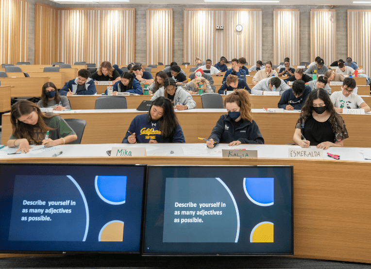 college students sitting at desks in Chou Hall classroom