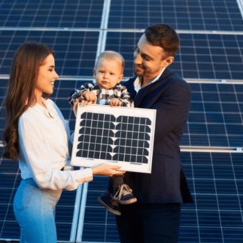 A family stands in front of solar panels
