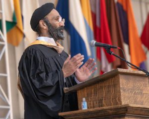 Jagdeep Singh, MBA 90, speaks at MBA commencement at podium