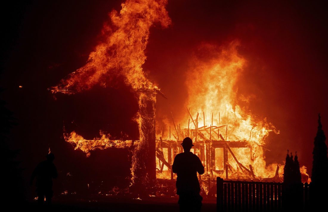 A home burns as the Camp Fire rages through Paradise, Calif on Nov. 8, 2018