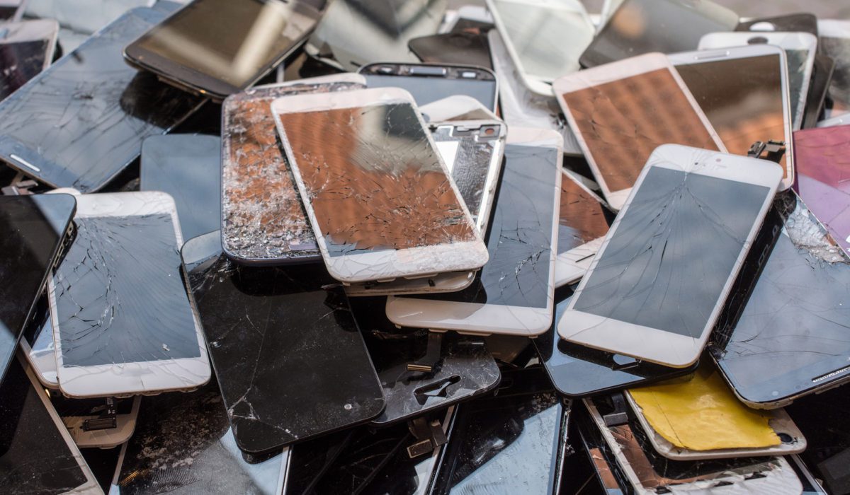 Stack of broken screens from smartphones