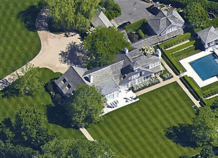 Aerial view of mansion with pool
