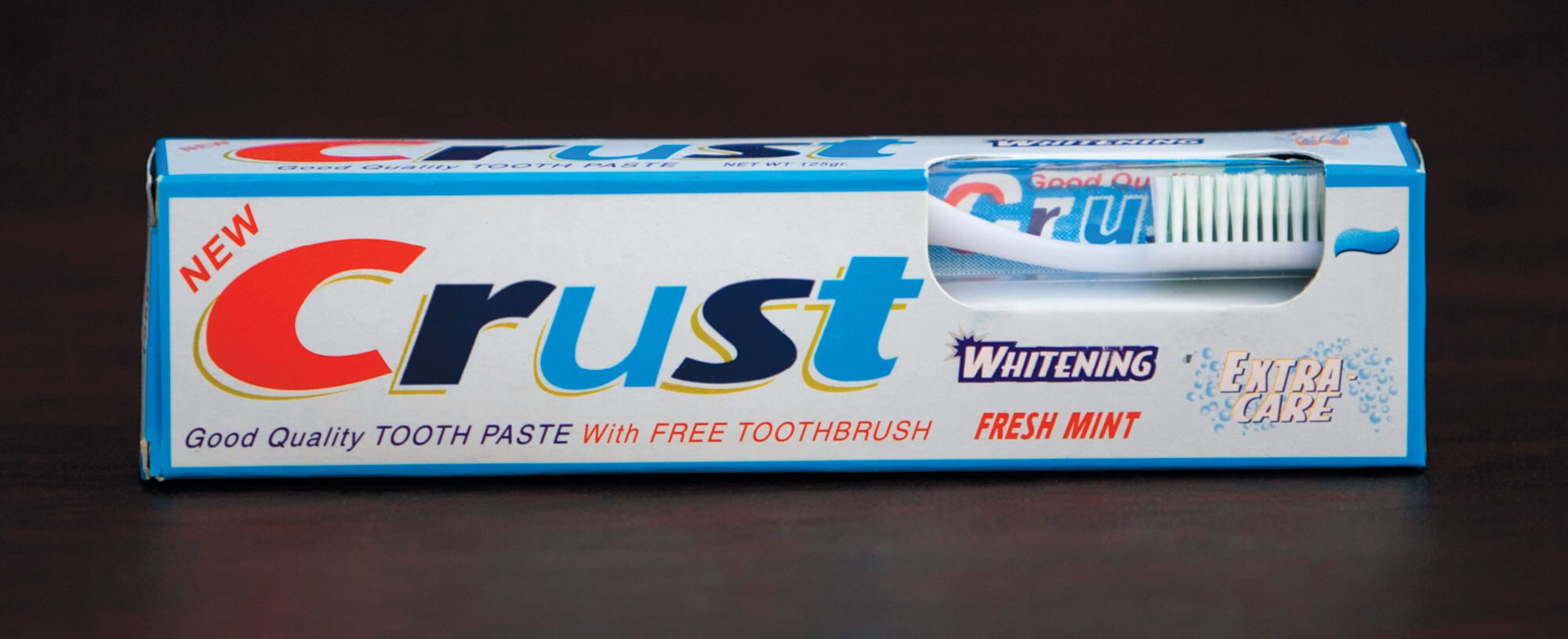 Box of Crust toothpaste with the branding of Crest toothpaste.