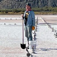 Charles (Tim) O’Brien standing with a shovel.