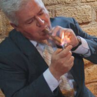 Nelson Estrada smoking a cigar.