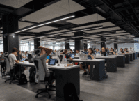 People sitting at desks in a large office space