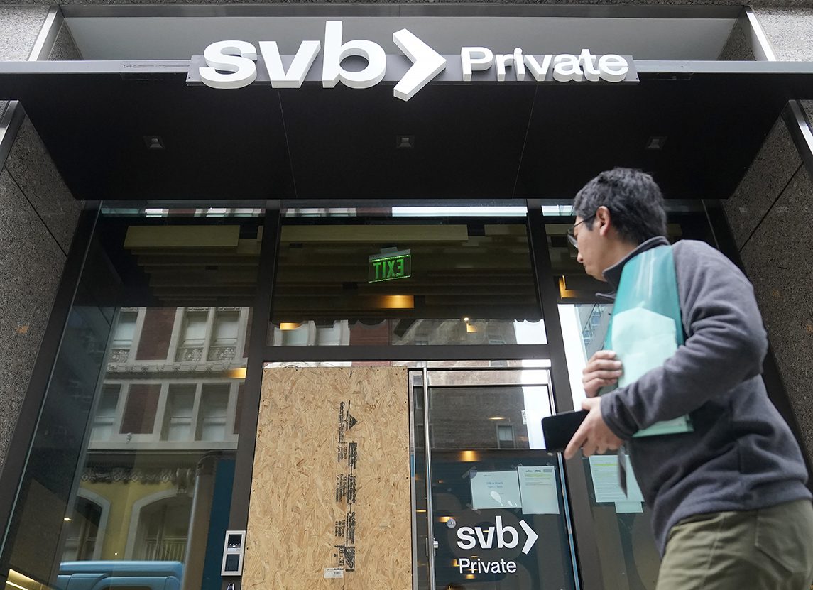A pedestrian passes a closed Silicon Valley Bank branch in San Francisco on Monday, March 13, 2023.