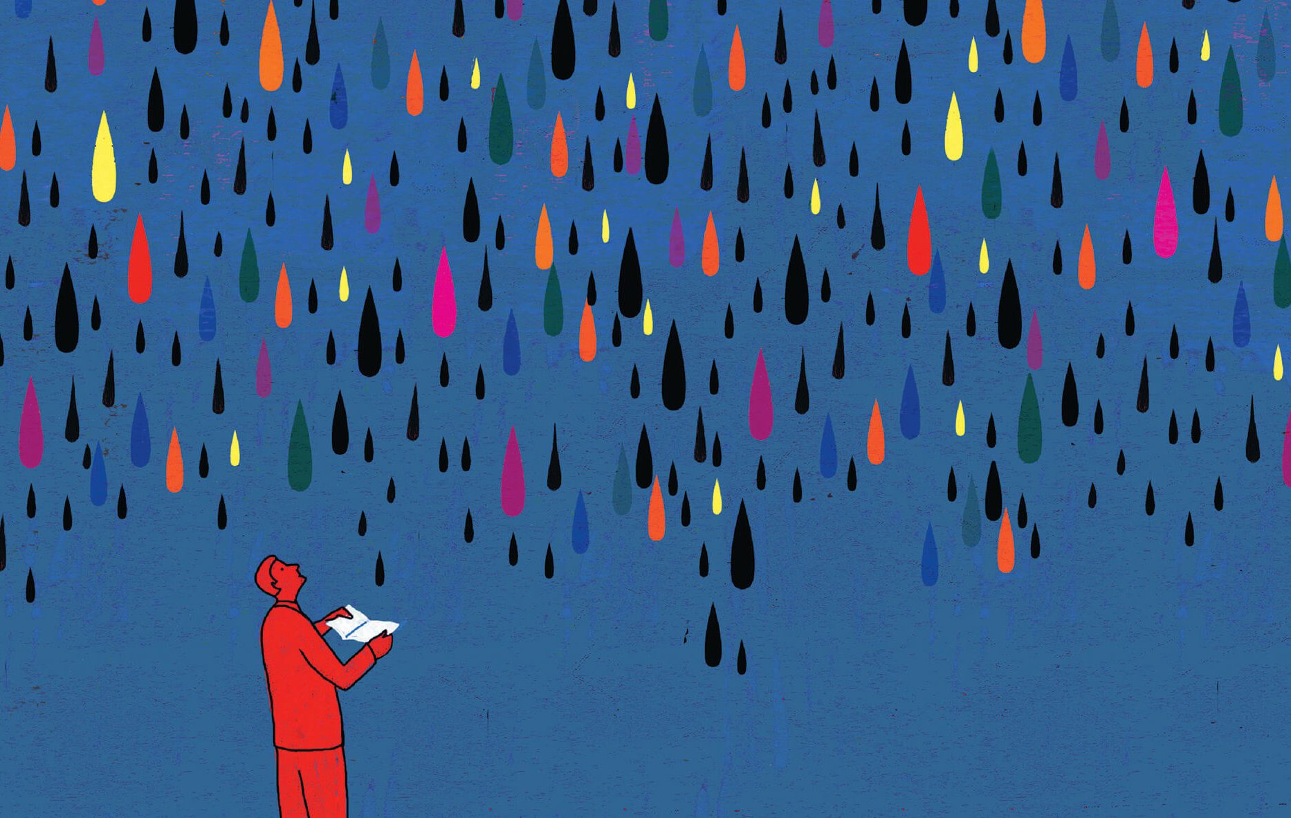Man holding a book open as drops of multicolored ink rain down.