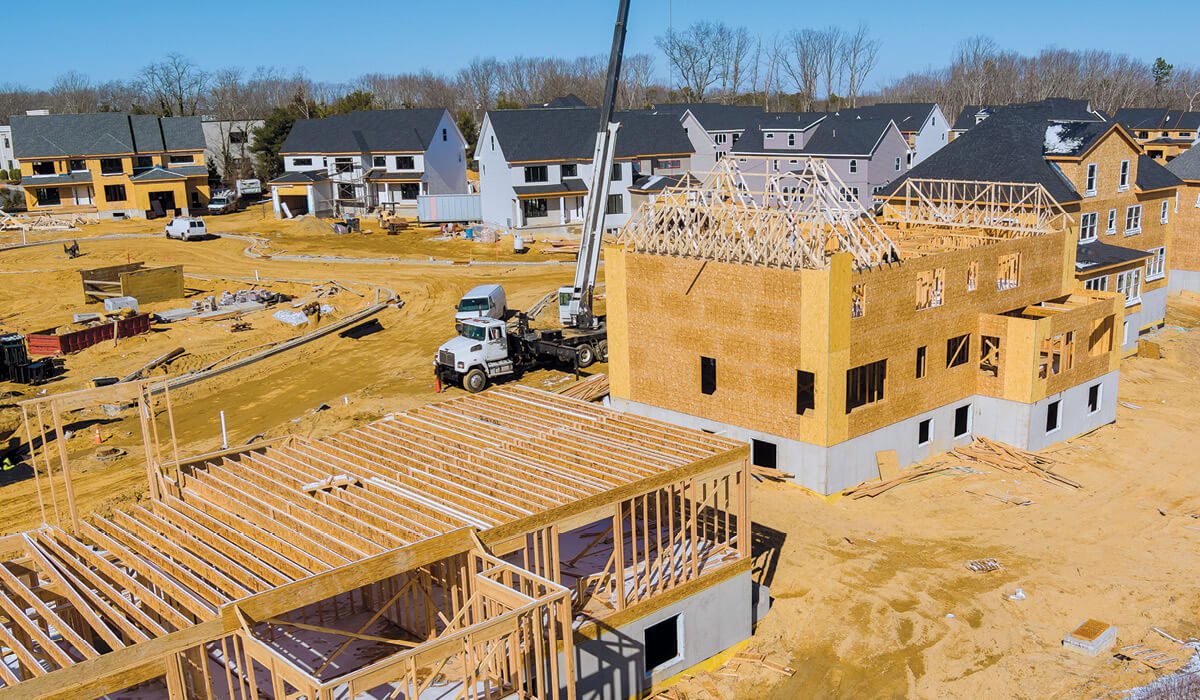 Image of a construction site of new homes being built.