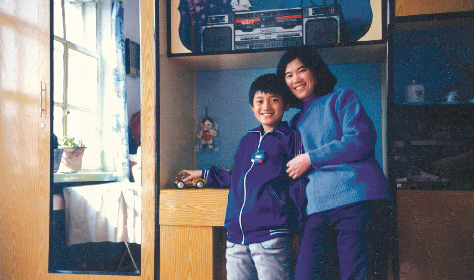 image of a polaroid photo of a mother and son inside a home.