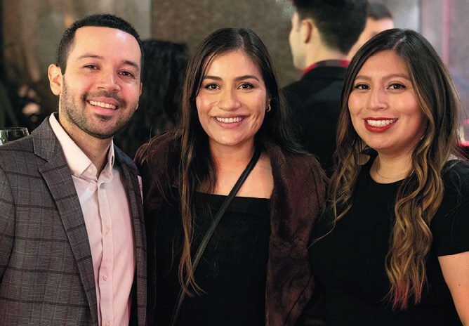 Jose Avalos, MBA 21; Jen Avalos; and Jen Lopez, MBA 21 at the MBA Class of 2021 Holiday Party.