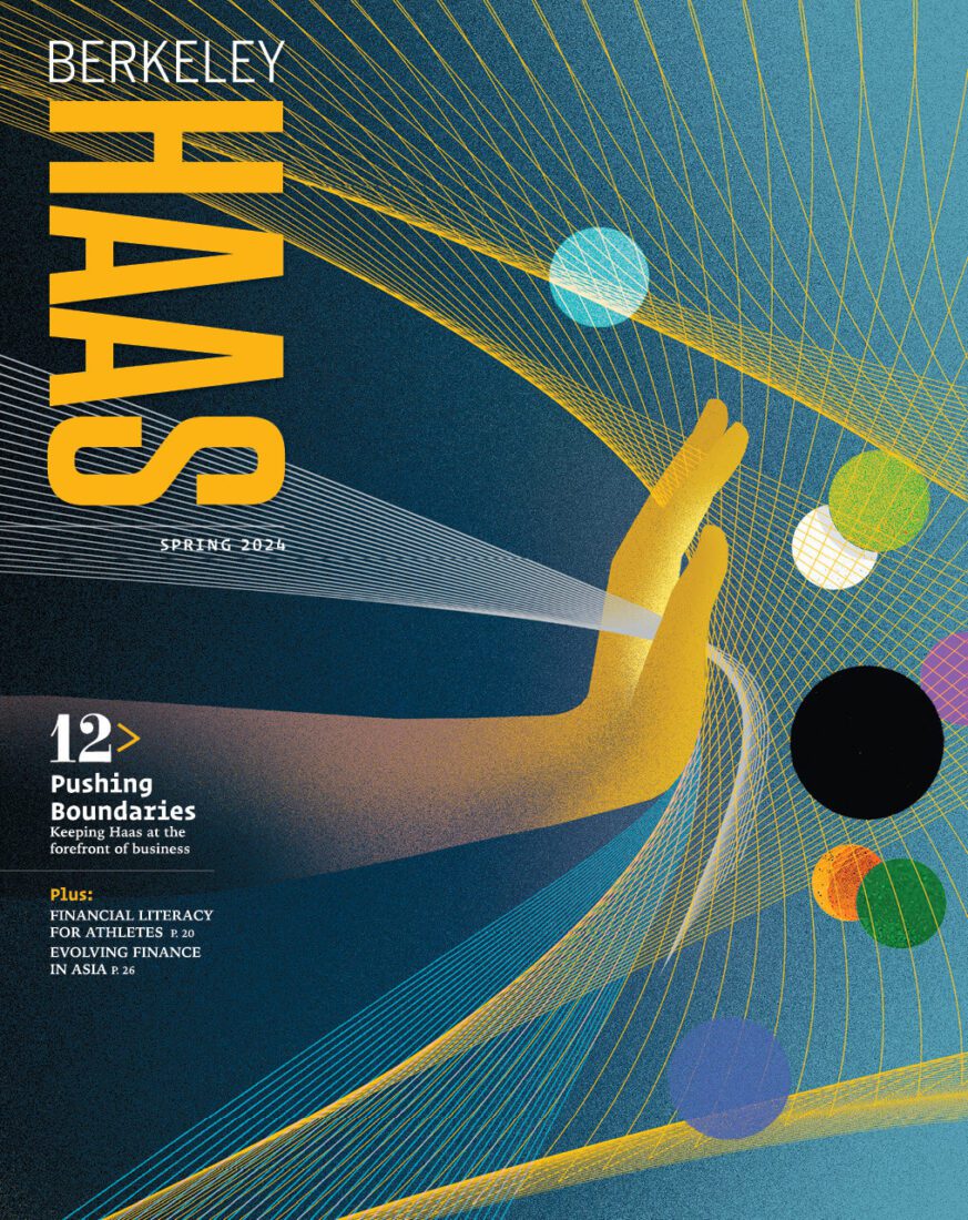 Spring 2024 cover of Berkeley Haas magazine showing a blue and gold arm and hand pushing into a web of swirling and intersecting lines and multicolored balls meant to represent technology.