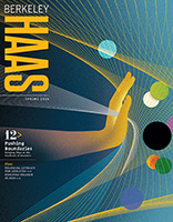 Spring 2024 cover of Berkeley Haas magazine showing a blue and gold arm and hand pushing into a web of swirling and intersecting lines and multicolored balls meant to represent technology.