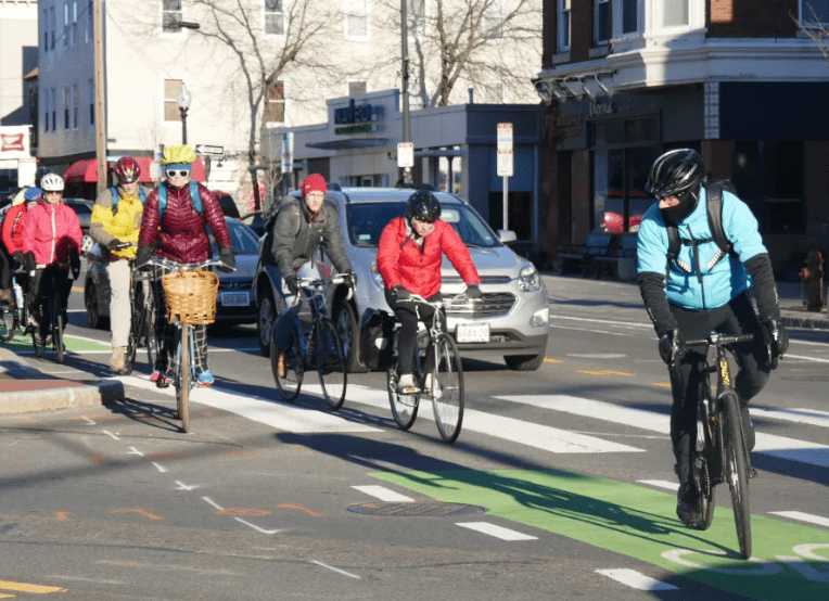 Photo of bike riders riding their bikes.