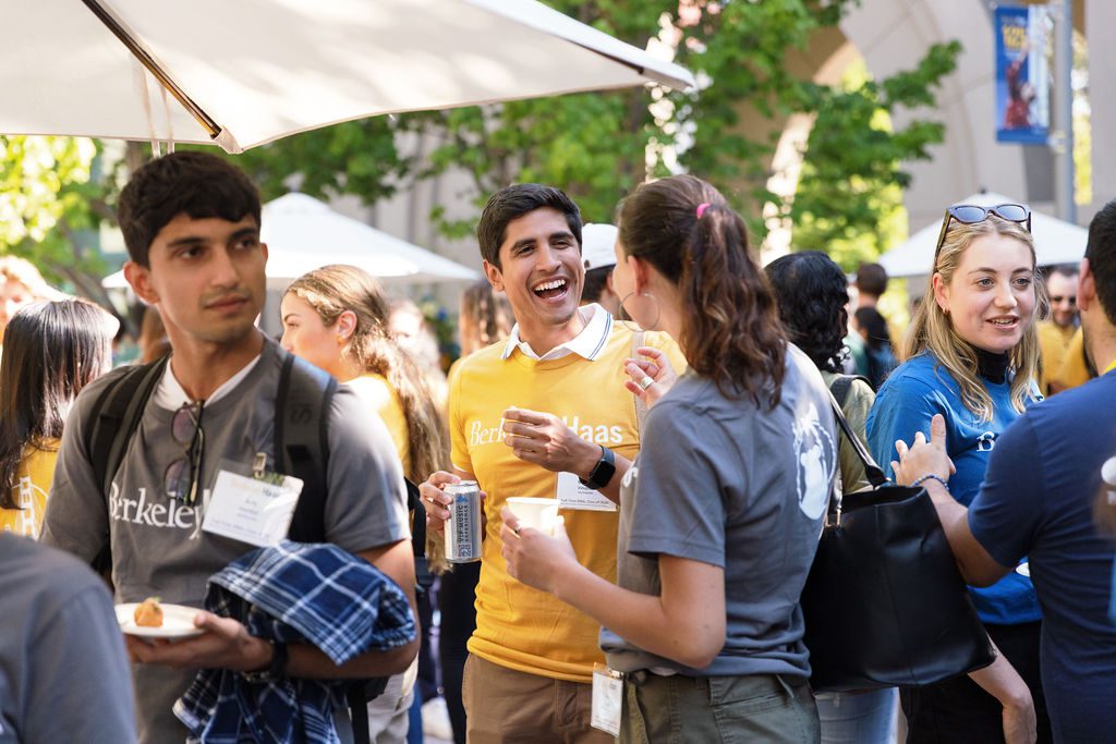 students mingling in the Haas courtyard wearing Haas tshirts