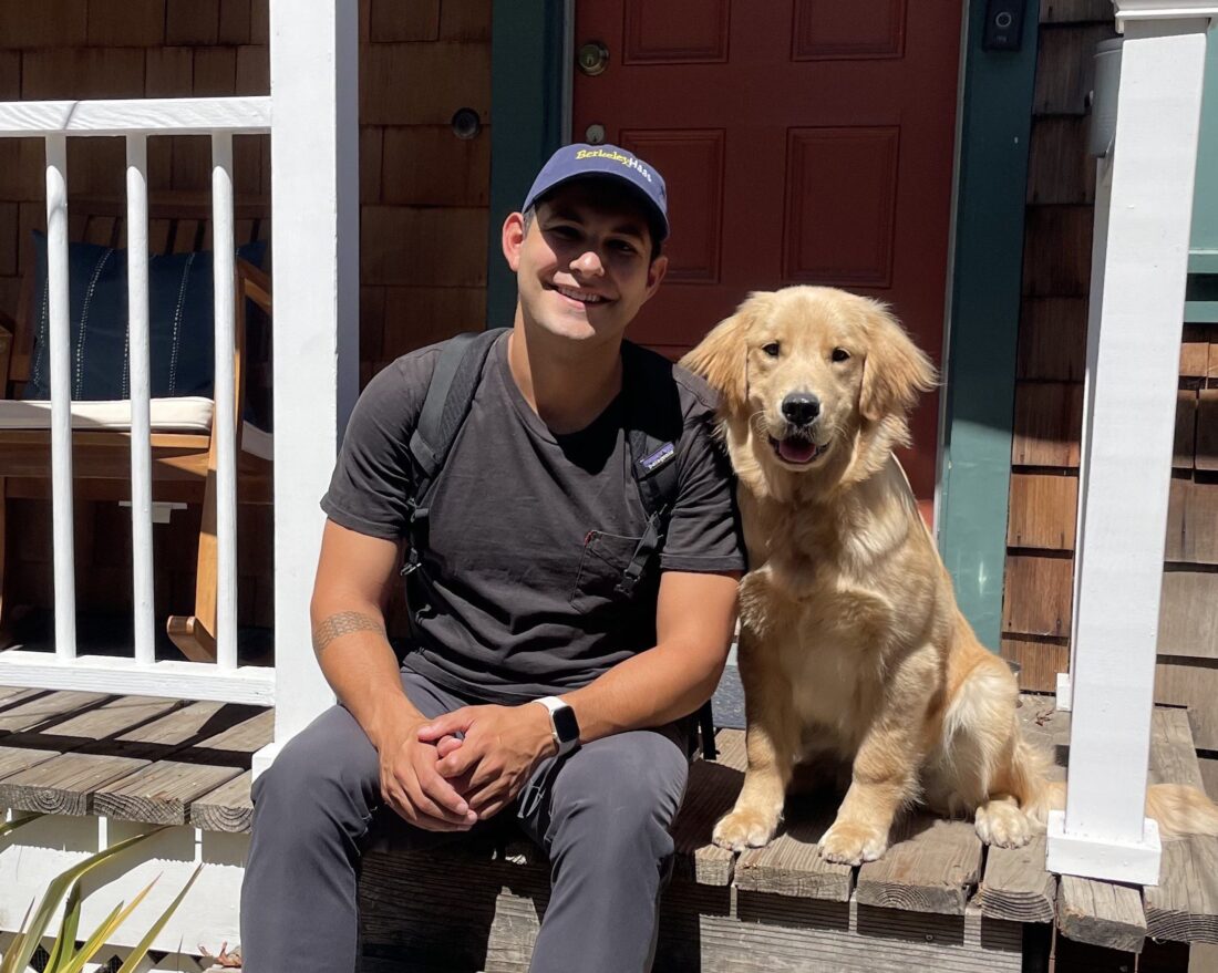 man and golden retriever