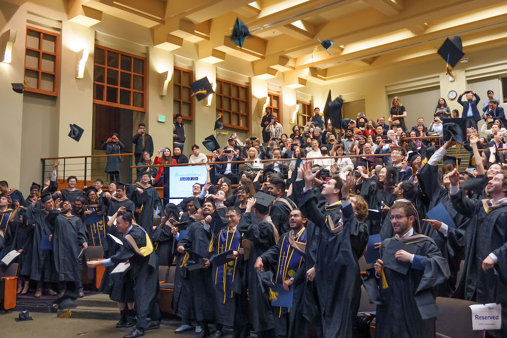 Graduates tossing their caps